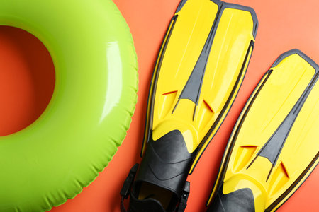 Flat lay composition with beach accessories on orange backgroundの写真素材