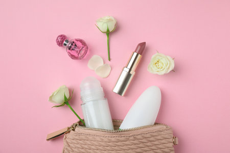 Flat lay composition with natural female deodorants and cosmetics on pink backgroundの写真素材