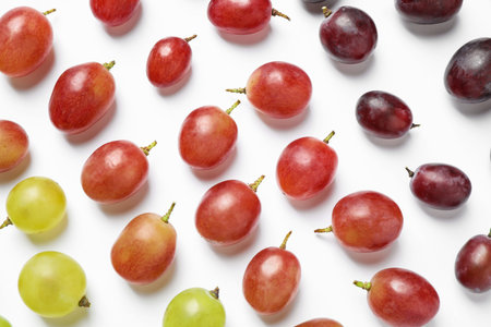 Fresh ripe juicy grapes on white background, top viewの写真素材