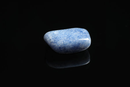 Beautiful blue quartz gemstone on black backgroundの写真素材