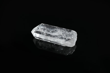 Beautiful rock crystal gemstone on black backgroundの写真素材