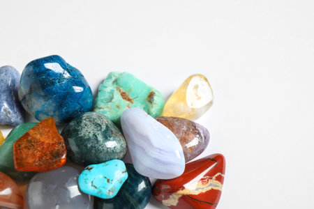 Different beautiful gemstones on white background, top viewの写真素材