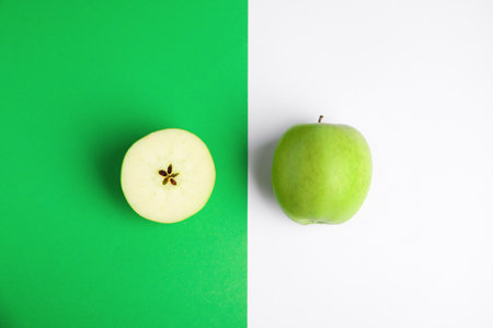 Flat lay composition of fresh ripe green apples on color backgroundの写真素材