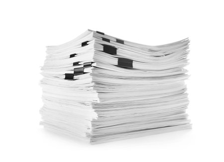 Stack of documents with black clips on white backgroundの写真素材