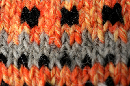 Knitted soft woolen sock as background, closeup