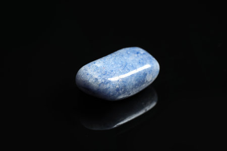 Beautiful blue quartz gemstone on black backgroundの写真素材