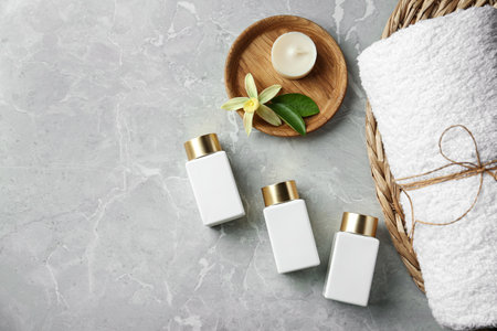 Flat lay composition with cosmetic products on gray stone table, space for text. spa therapyの写真素材