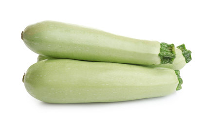 Fresh ripe green zucchinis isolated on whiteの写真素材