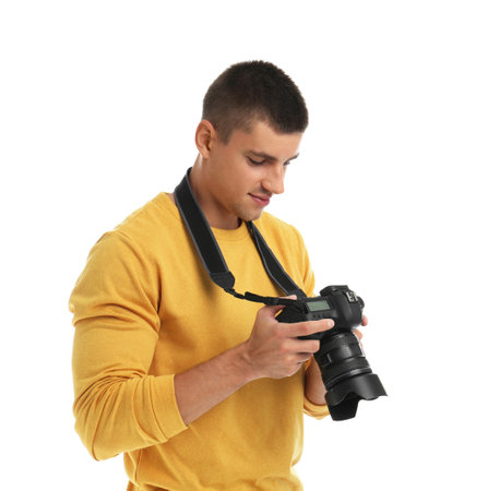 Young photographer with professional camera on white backgroundの写真素材