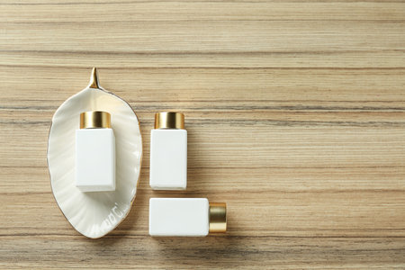 Flat lay composition with cosmetic products on wooden table, space for text. spa therapyの写真素材