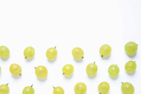 Fresh ripe juicy grapes on white background, top viewの写真素材