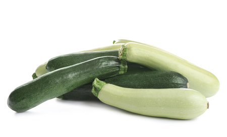 Fresh ripe green zucchinis isolated on whiteの写真素材