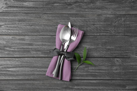 Cutlery set for festive table on dark wooden background, top viewの写真素材
