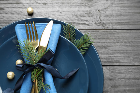 Christmas table setting on gray wooden background, flat layの写真素材
