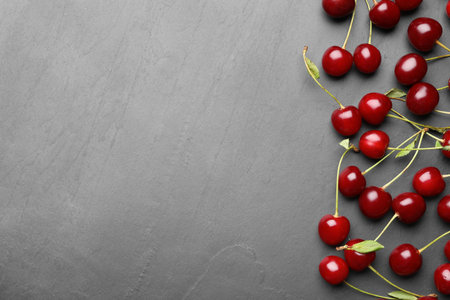 Delicious cherry on gray background, flat layの写真素材