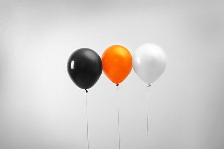 Colorful balloons on light background. halloween partyの写真素材
