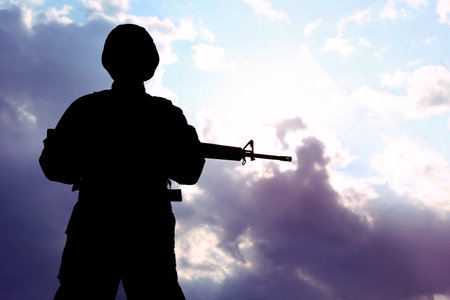 Soldier with machine gun patrolling outdoors. military serviceの写真素材