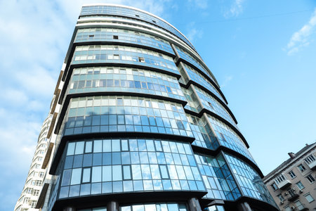 KYIV, UKRAINE - MAY 23, 2019: Modern office building against blue skyのeditorial素材