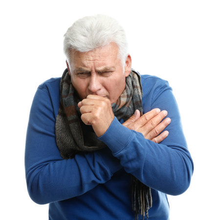 Mature man suffering from cold on white backgroundの写真素材
