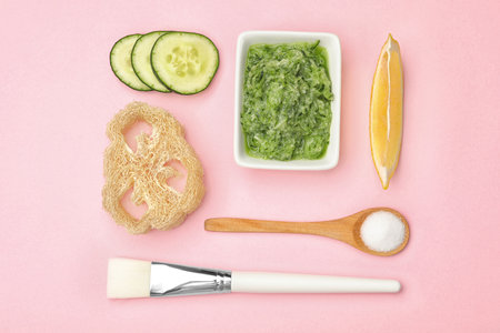 Flat lay composition with handmade face mask and ingredients on pink backgroundの写真素材