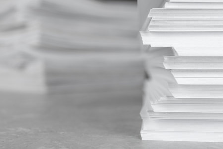 Stack of blank white paper on table, closeup. Space for text