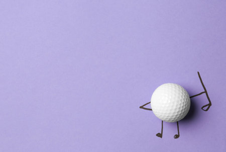 White ball as golf player on lilac background - creative image. top viewの写真素材
