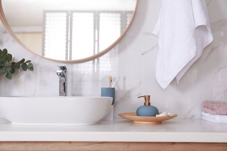 Stylish bathroom interior with vessel sink and decor elementsの写真素材