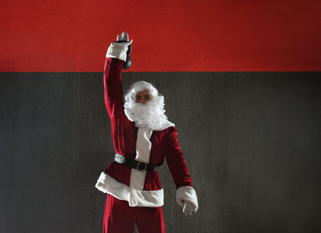 Young Santa Claus training in modern gymの写真素材