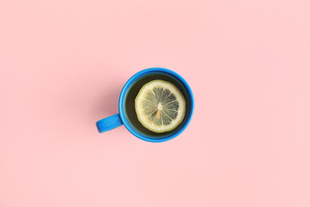 Cup of tea on pink background, top viewの写真素材
