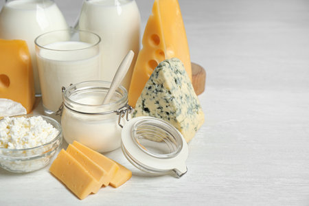 Different delicious dairy products on white tableの写真素材