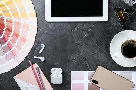 Flat lay composition with digital devices and color palette on gray background, space for text. Graphic designer's workplaceの写真素材