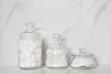 Cotton balls, swabs and pads on white table indoorsの写真素材