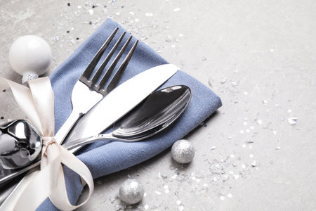 Cutlery set on gray table, space for text. christmas celebrationの写真素材