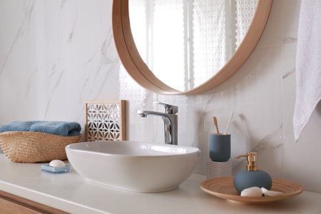 Stylish bathroom interior with vessel sink and decor elementsの写真素材