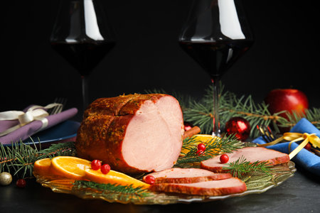 Delicious ham served on dark table. christmas dinnerの写真素材