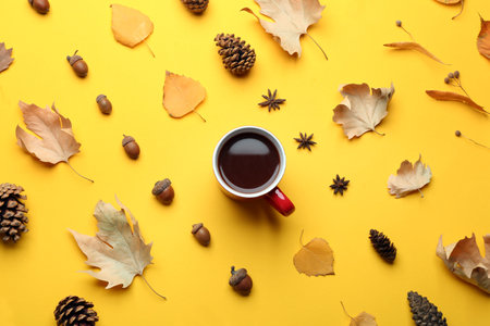 Flat lay composition with hot drink on yellow background. Cozy autumnの写真素材