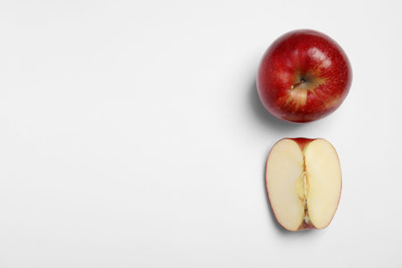 Ripe juicy red apples on white background, top viewの写真素材