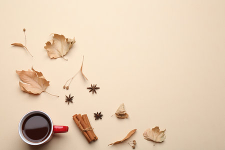Flat lay composition with hot drink on beige background, space for text. Cozy autumnの写真素材