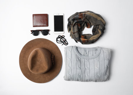 Stylish male autumn outfit and accessories on white background, flat lay. trendy warm clothes