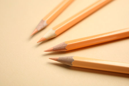 Composition with color pencils on beige background