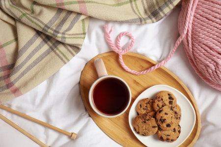 Flat lay composition with cup of hot winter drink on light fabricの写真素材