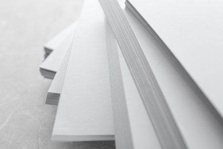 Stack of blank white paper on marble table, closeupの写真素材