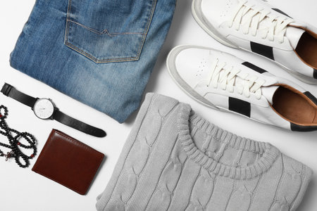 Stylish male autumn outfit and accessories on white background, flat lay. trendy warm clothesの写真素材