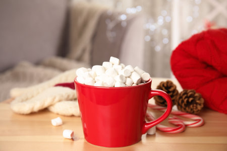 Cup of hot cocoa with marshmallows on wooden table indoors. winter drinkの写真素材