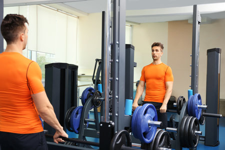 Young man having heart attack in the gym