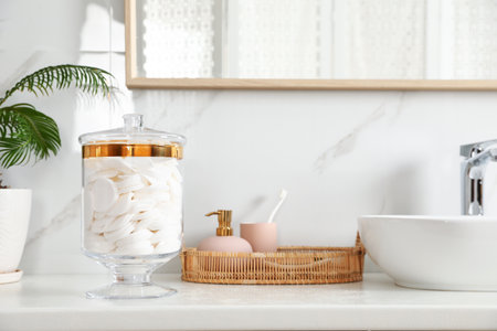 Jar with cotton pads on bathroom countertopの写真素材