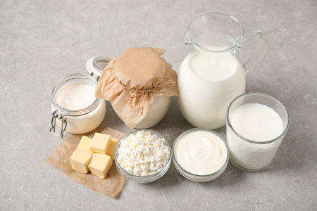 Different delicious dairy products on light tableの写真素材
