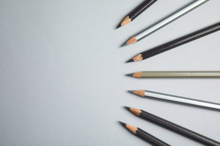 Flat lay composition with color pencils on gray background. Space for textの写真素材