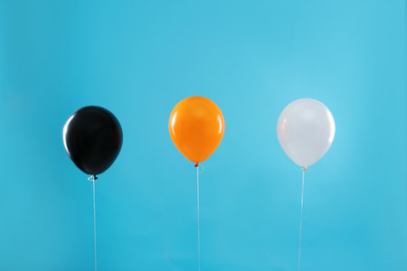 Colorful balloons on blue background. halloween partyの写真素材