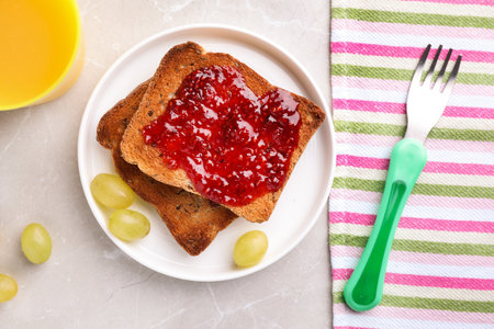 Flat lay composition with toasts and grapes on light gray marble table. healthy breakfastの写真素材
